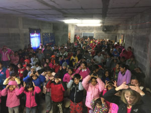 Crossing Borders Crowd learns songs at Marta