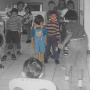 photo of reuel and lucellie as children playing games