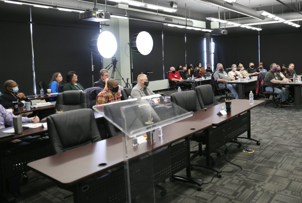 Group of 20 people seated in training room